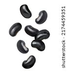 Black beans (Urad dal, black gram, vigna mungo) flying in the air isolated on white background. 