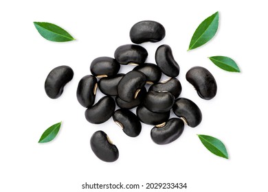 Black beans ( Urad dal, black gram, vigna mungo ) with green leaves isolated on white background . Top view. Flat lay. 