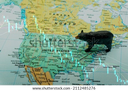 black bear placed on a map of the United States. a bear market, a fall in the stock market. Economic downturn, financial crisis.bearish.down trend investment,US stocks，Stock k-line double exposure