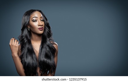 Black beautiful woman with long luxurious shiny hair