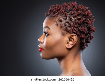 Black beauty with short spiky red hair