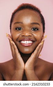 Black Beauty Woman With Perfect Skin After Fantastic Face Treatment. Isolated Over Pink Background. Beautiful African Woman. Skin Care. Beauty Skin. Beautiful