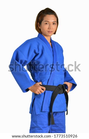 Black belt judo girl in blue kimono