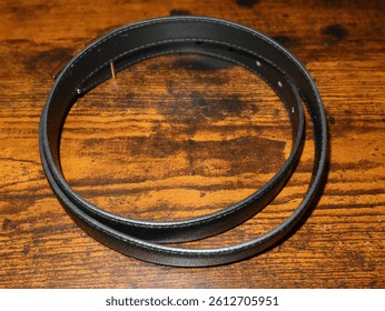 a black belt on a wooden table