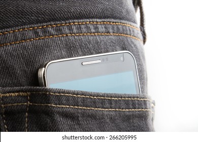Black big cellphone protrude from back jean pocket.