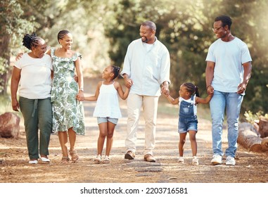 Black Big Family, Love And A Walk In Nature, Outdoors Or Outside On Holiday, Vacation Or Trip. African Ancestry, Grandmother Or Children With Mother, Fathers Or Siblings Together Walking At The Park