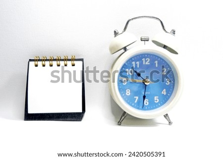 Black blank Calendar and white alarm clock on white background copy space stock photo