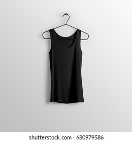 Black Blank Tank Top, Sleeveless T-shirt Mockup On Hanger, Hanging Against Empty Wall Background.