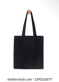 Black Blank Tote Bag Mock Up Design On White Background Hanging On Wooden Hanger