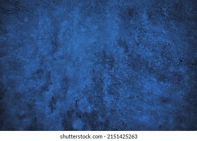   Black blue abstract background. Toned rough concrete wall surface texture. Close-up. Dark background with space for design. Grunge backdrop.                             