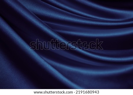  Black blue silk satin. Dark elegant background with space for design. Soft folds. Wavy. Shiny smooth fabric. Luxurious. Valentine, 14.02, Christmas, New year, festive.                             