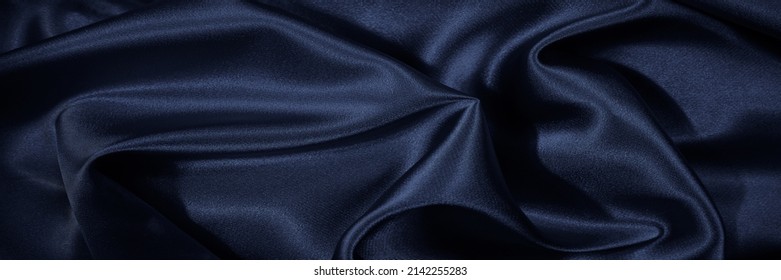     Black Blue Silk, Satin. Shiny Fabric Surface. Beautiful Wavy Folds. Dark Elegant Background With Space For Design. Web Banner.                           