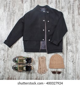 Black Bomber Jacket, Sunglasses, Beige Hat, Gloves And Military Sneakers