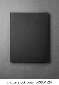 Black Book Cover On The Gray Background.