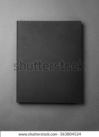 Black book cover on the gray background.