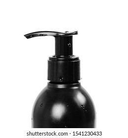 Black Bottle With Liquid Soap Dispenser. Close Up. Isolated On White Background.