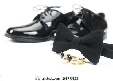 Black bow and men's classic shoes isolated over white - Powered by Shutterstock