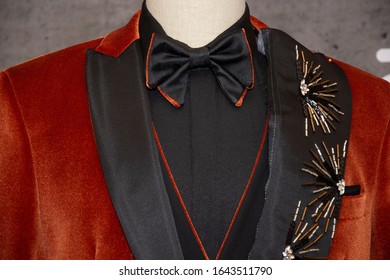 Black Bow Tie On A Orange Brown Velvet Suit