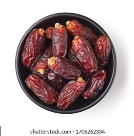 Black bowl of dates isolated on white background; top view