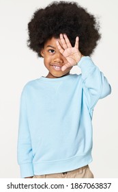 Black Boy Wearing Blue Sweater In Studio