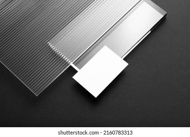 Black branding business card mockup template, with trendy reeded glass elements, real photo. Blank isolated on a black background to place your design
