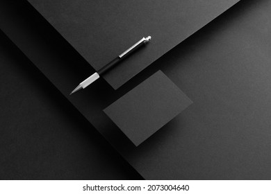Black branding stationery mockup template, real photo, letterhead, flyer, poster, business card, envelope. Blank isolated on black background to place your design. - Shutterstock ID 2073004640