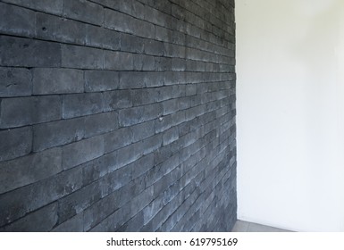 black brick background with white panel