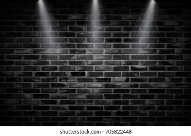 Black Brick Wall Of Dark Stone Texture With Light Of Fire. Spotlight