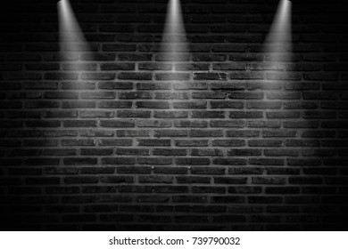 Black Brick Wall Of Dark Stone Texture With Light Of Fire. Spotlight