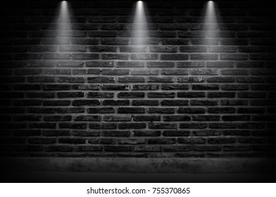 Black Brick Wall Of Dark Stone Texture With Light Of Fire. Spotlight