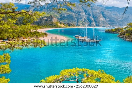 Black and Brown gulet anchored at the Aegean sea - Panoramic view of Oludeniz Beach And Blue Lagoon, Oludeniz beach is best beaches in Turkey - Fethiye, Turkey