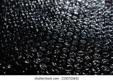 Black Bubble Wrap Close Up Background - at an angle