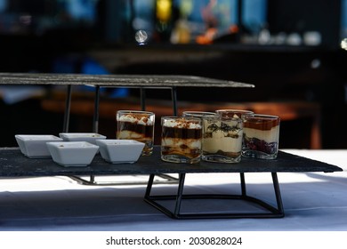 Black buffet table with beautiful decorated dishes. Breakfast at hotel. Catering. Decoration for a Banquet. High quality photo