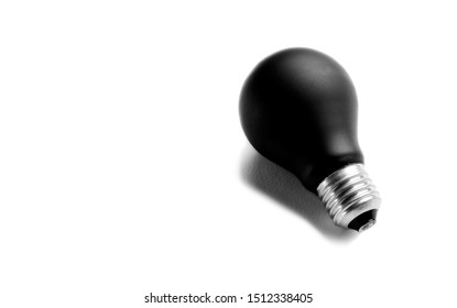 Black Bulb Isolated On White Background. Concept Of Power Outage Or Reactionary Thought And Ideas