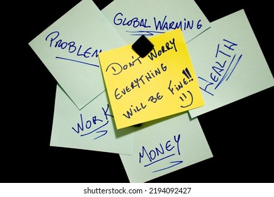 Black Bulletin Board With Post-it Notes, With Blue Sheets With Negative Information And A Yellow One With Motivational Phrase