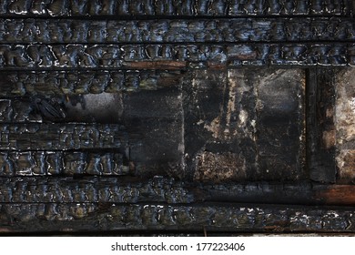 Black Burnt Wooden Wall.  Grunge Background.