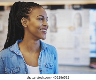Black Business Woman Smiling While Standing In Her Own Store