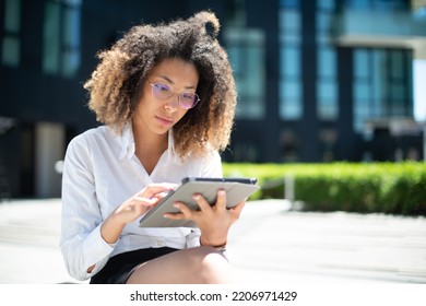 Black Business Woman Using Her Digital Tablet Outdoor In A Business Environment