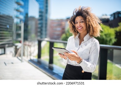 Black Business Woman Using Her Digital Tablet Outdoor In A Business Environment