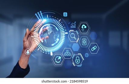 Black businessman hand, finger touch earth globe hologram with digital icons. Concept of global internet and worldwide connection.