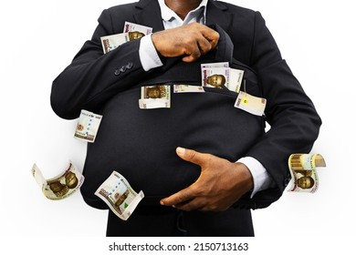Black Businessman holding black bag full of Nigerian naira notes isolated on white background, money falling from bag