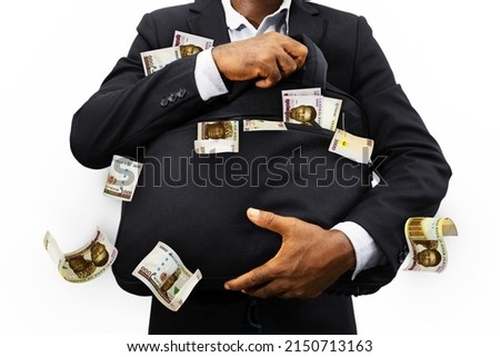 Black Businessman holding black bag full of Nigerian naira notes isolated on white background, money falling from bag