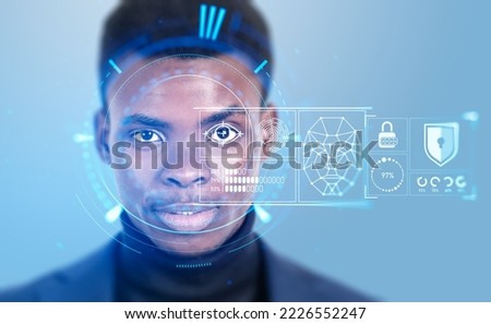 Black businessman portrait with biometric data scanning and analysis on virtual screen. Face detection and artificial intelligence. Concept of face id