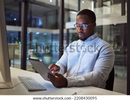 Black businessman, tablet and data analysis with computer in night office for digital marketing software, cybersecurity code or kpi. Thinking programmer, developer or website designer with technology