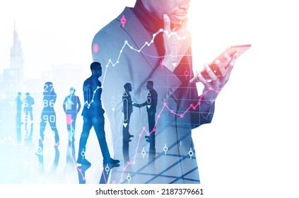 Black businessman with tablet in hands, pensive look. Business people working together, double exposure with forex diagrams, candlesticks and skyscrapers. Concept of conference - Powered by Shutterstock