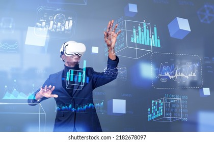 Black businessman in vr glasses finger touch digital hologram, forex diagrams and floating financial analysis chart. Concept of blockchain and finance - Powered by Shutterstock