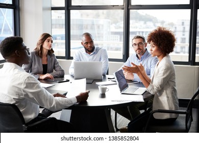 black businesswoman addressing colleagues at a corporate business meeting, close up