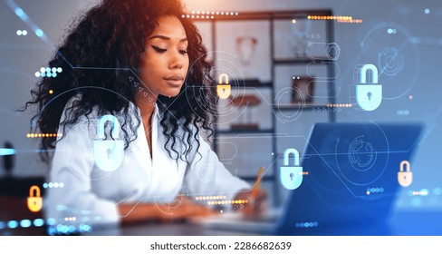 Black businesswoman take note and looking at laptop. Digital cybersecurity hud hologram double exposure, glowing lock and dashboard with information fields. Concept of data protection - Powered by Shutterstock