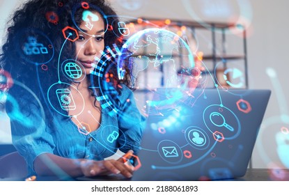 Black businesswoman using laptop, smiling. Earth sphere with digital hologram, glowing icons. Online network and connection hud. Concept of global internet and metaverse