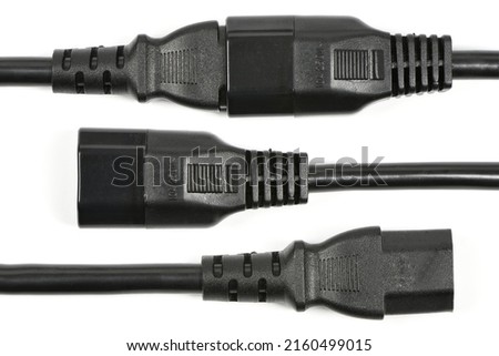 Black C13 female and C14 male rubber connector power plug, isolated on white. High resolution photo. Full depth of field.
